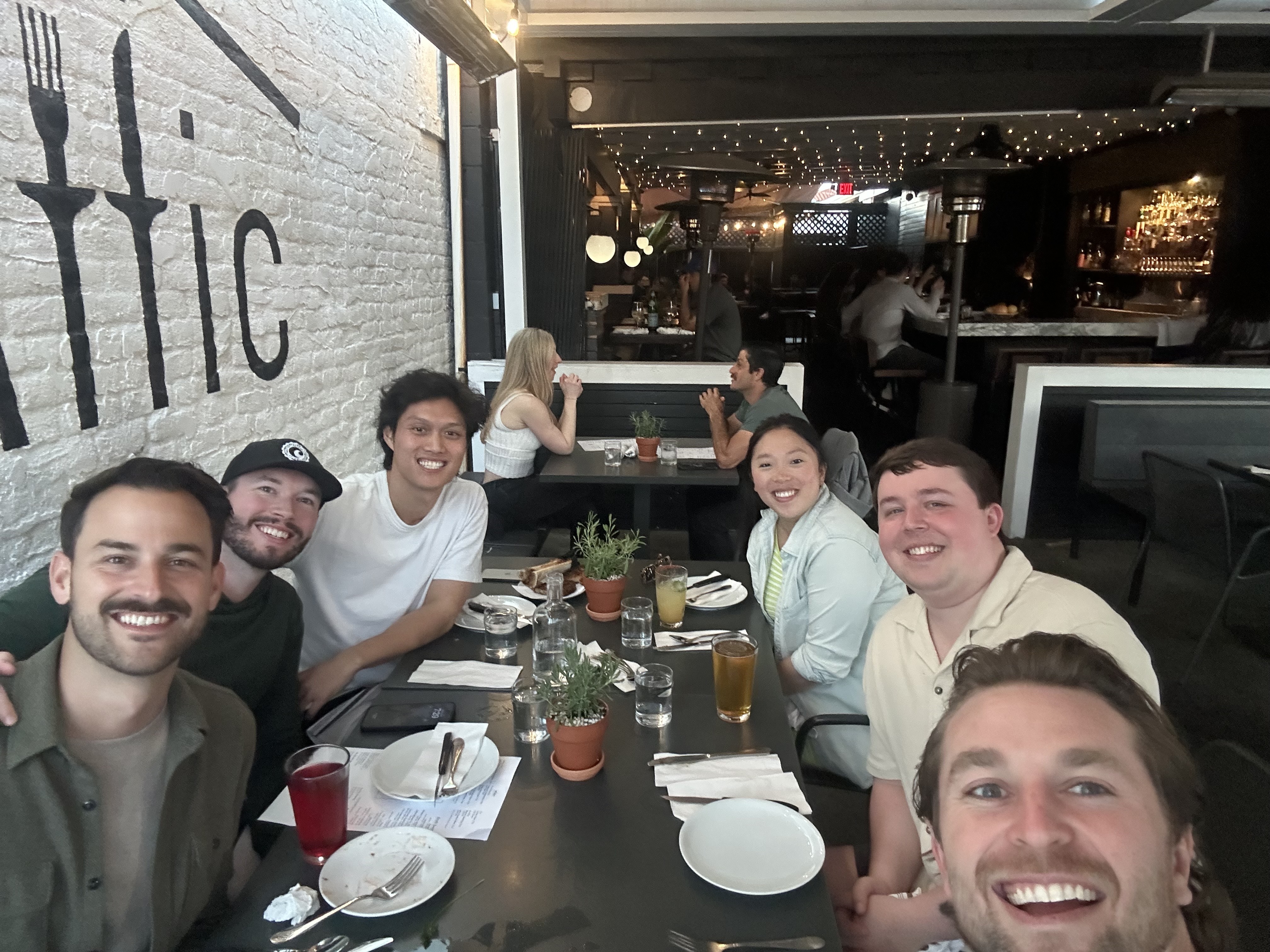 The Rynse team gathers around the table for dinner at The Attic restaurant.‍
